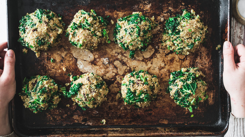 quinoa cakes on baking sheet