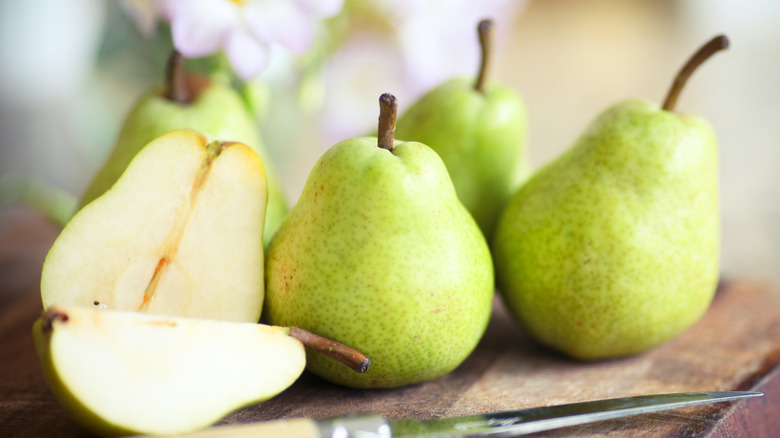 green pears on wooden board