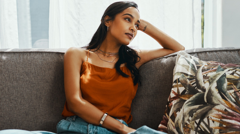 Anxious woman sitting on the couch