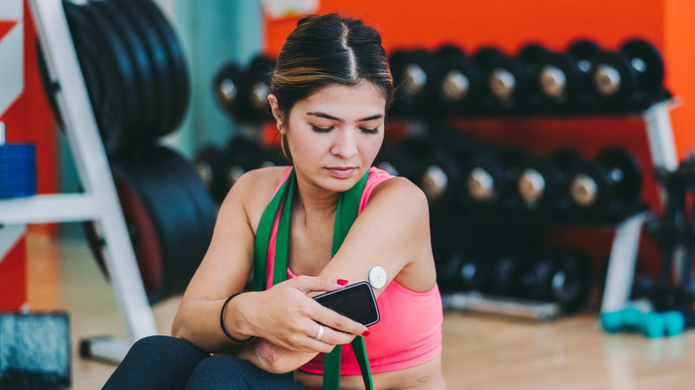 Young woman checking blood sugar