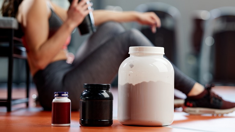 Woman drinking protein powder after a workout