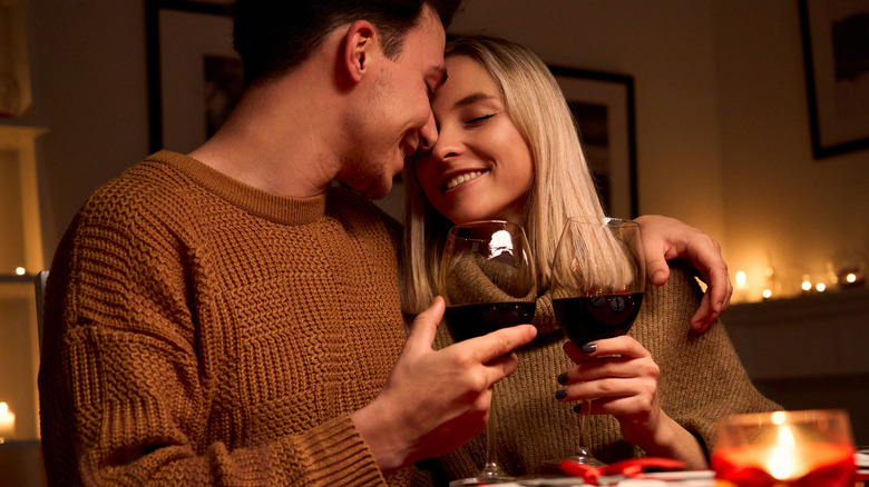 man and woman eating dinner together