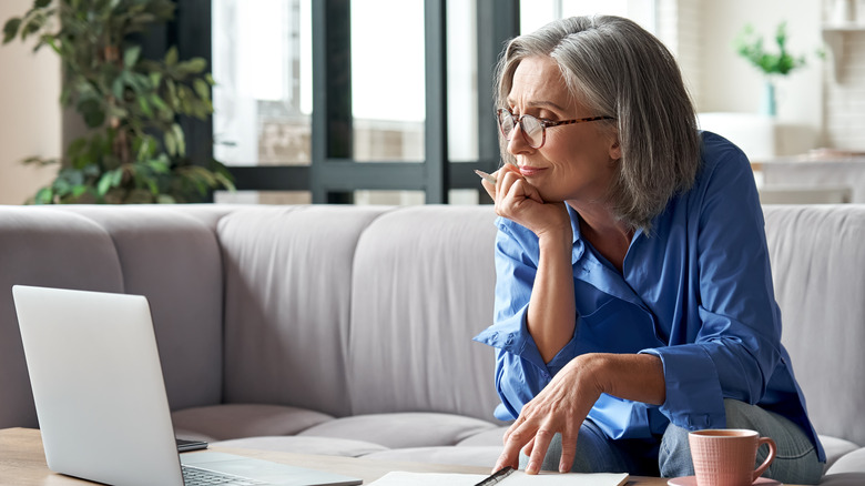 older woman looking at laptop screen