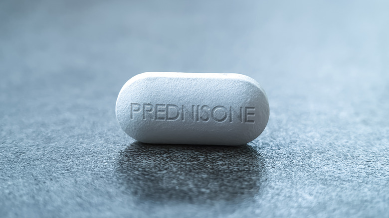 White pill labeled prednisone