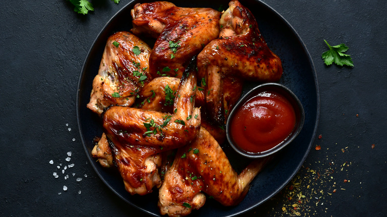 chicken wings on black plate