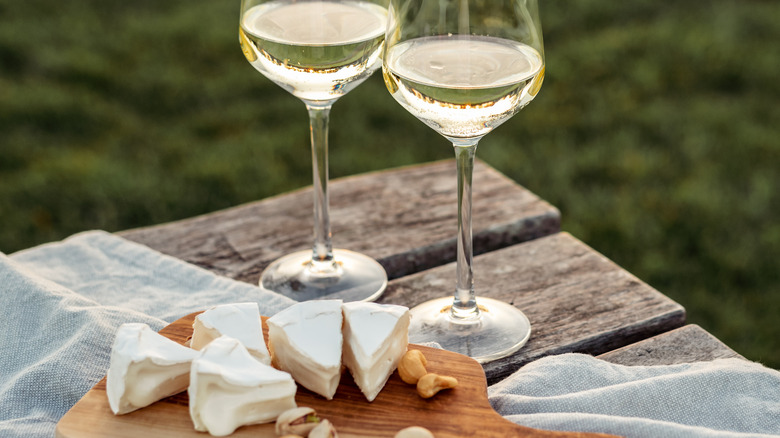 wine and cheese on table