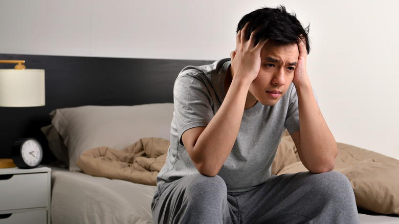 man feeling stressed with insomnia