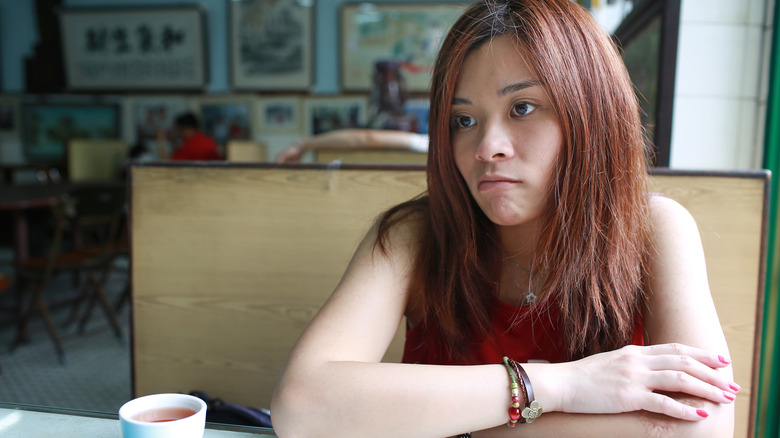 irritated woman waiting in restaurant