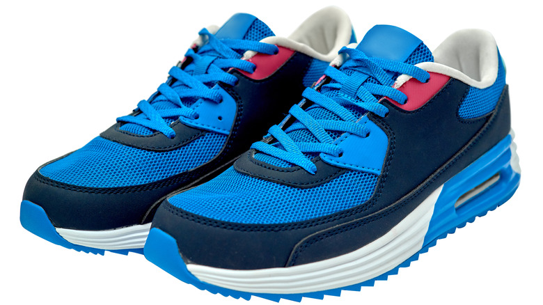 Blue running shoes on white background