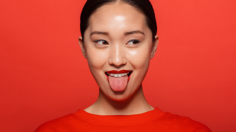 woman sticking out tongue