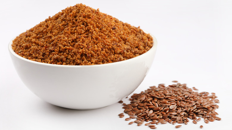 ground flaxseed with whole flaxseed on tablet