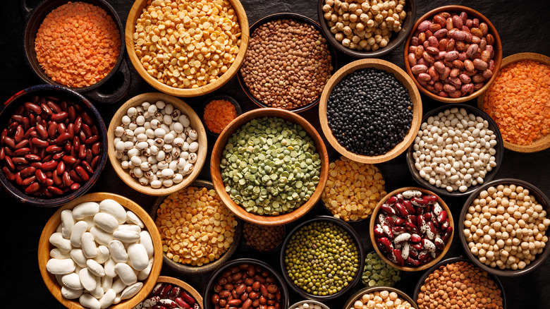 Image of many legumes over a black background