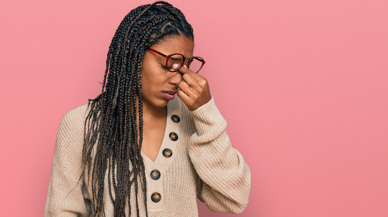 Woman experiencing a headache