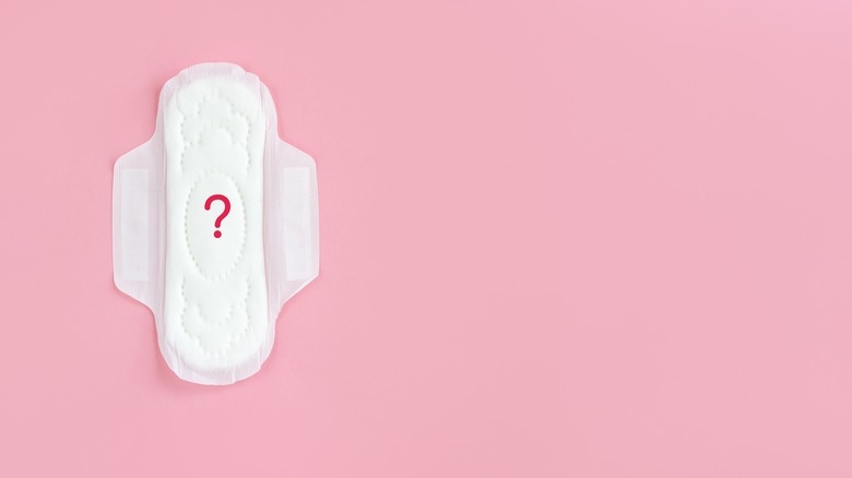 A sanitary pad with a question mark on it