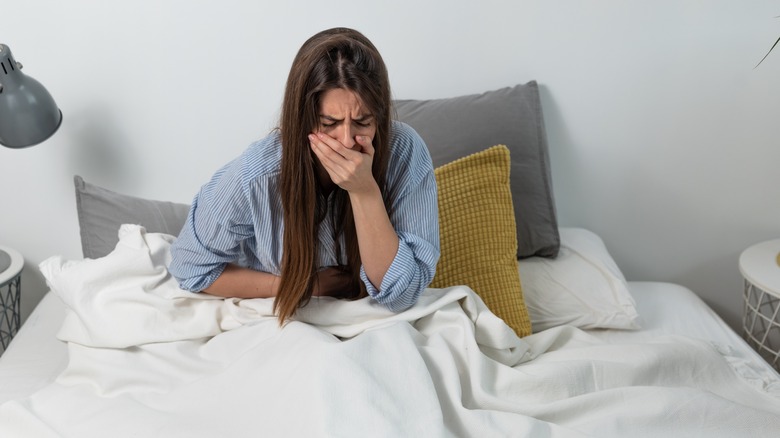 Woman feeling nauseous 