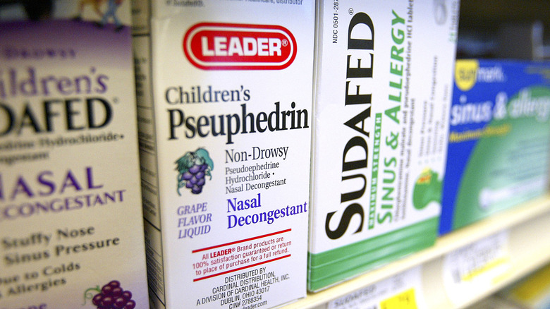 medication containing pseudoephedrine on shelf