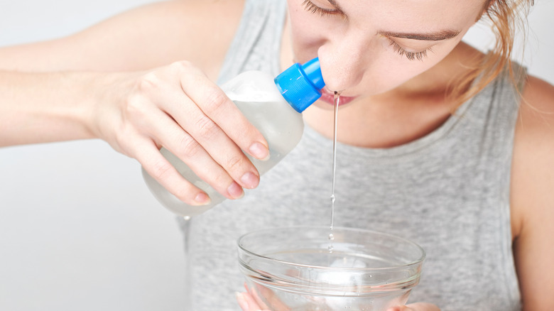 woman using saline solution