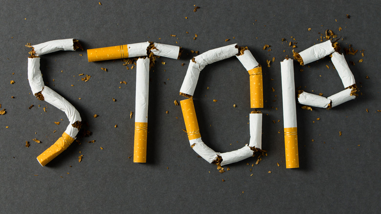 stop smoking spelled out with broken cigarettes