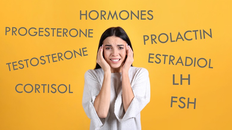 woman with hormones with yellow background