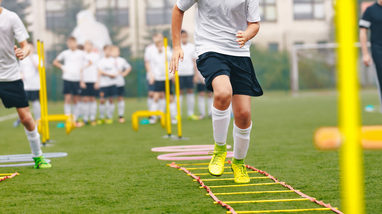 Young athlete performing agility ladder exercises
