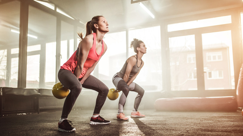 Woman performing kettlebell swings