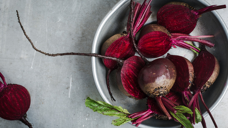 Whole and sliced beets in a bowl