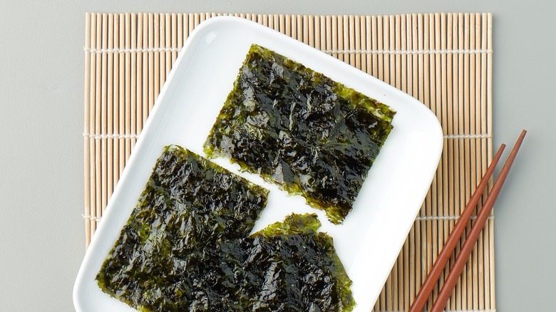 seaweed on white dish with chopsticks