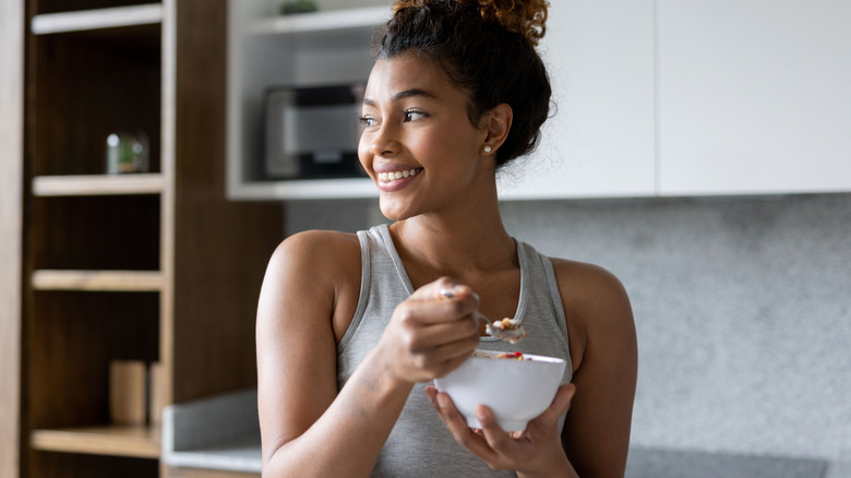 woman eating yogurt