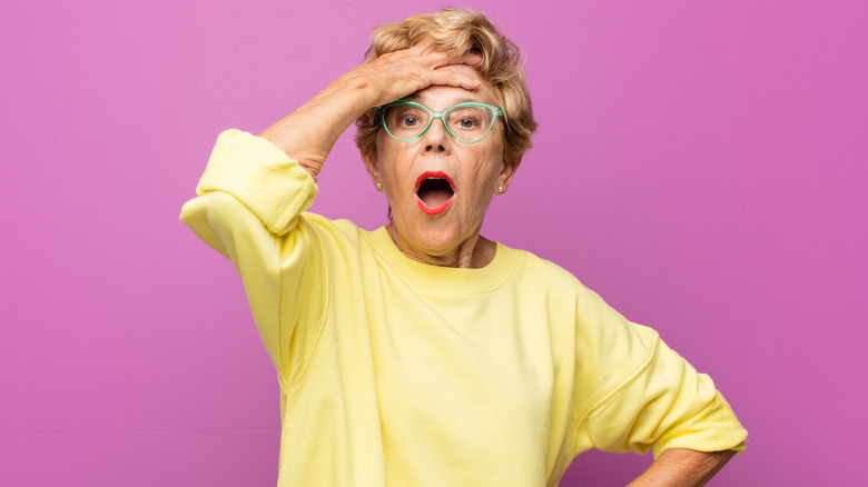 Older woman remembering something she forgot