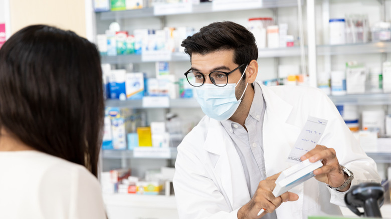 A person receiving medication at pharmacy 