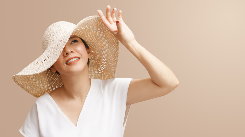 woman wearing hat in sunlight