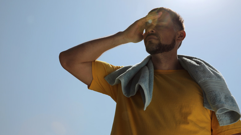 man suffering in heat