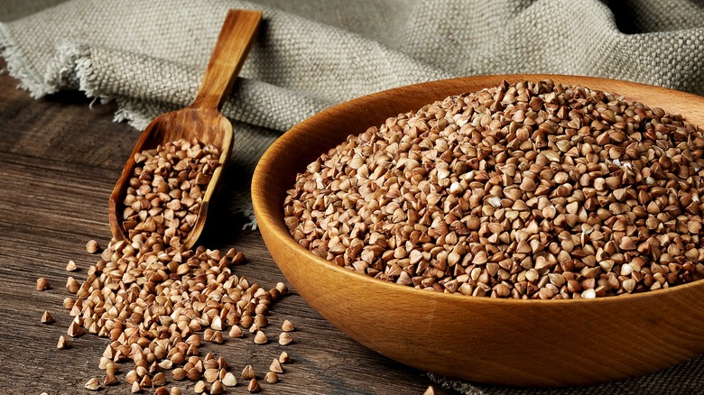 Organic buckwheat groats in a wooden bowl