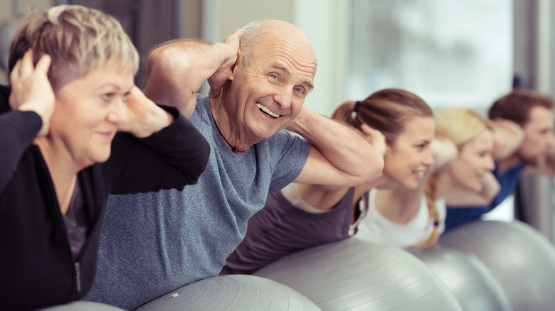 Group of people using exercise ball