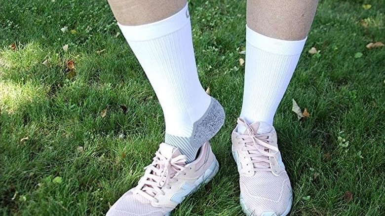 A pair of white compression socks