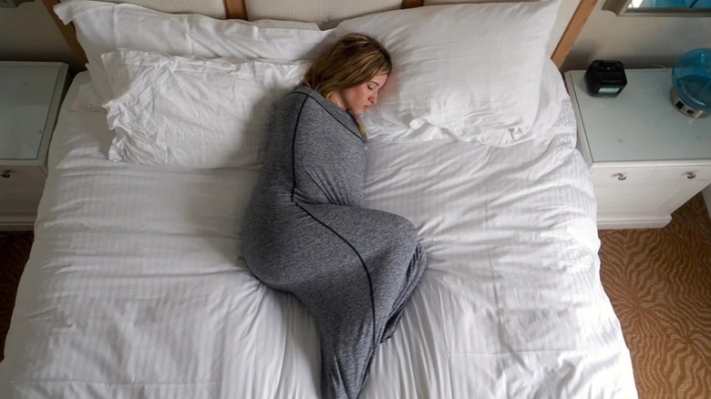 woman sleeping in sleep pod