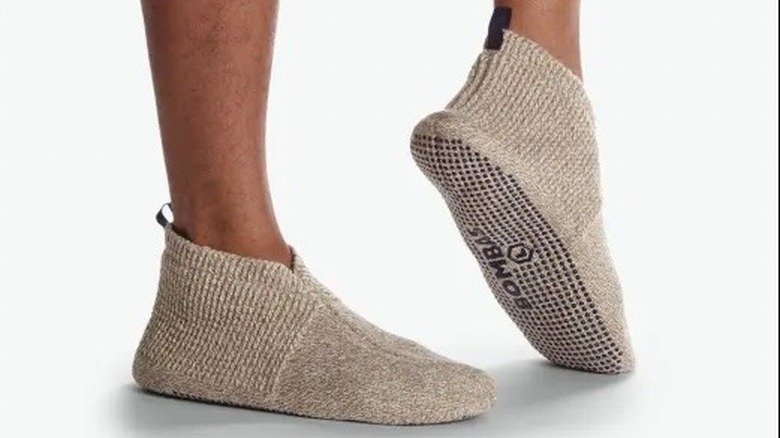 Feet wearing sock-like slippers