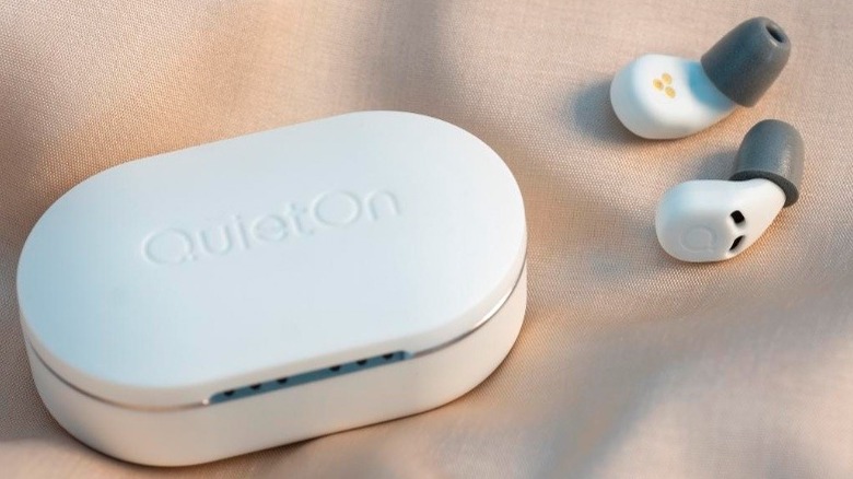 A white case and pair of earbuds