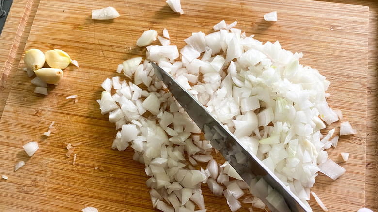 chopped onion on cutting board 