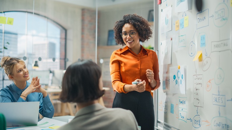 woman giving marketing workshop to adults