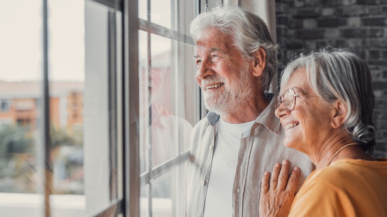 two older people smiling 