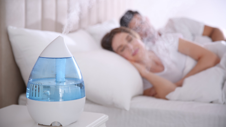 couple sleeping with humidifier