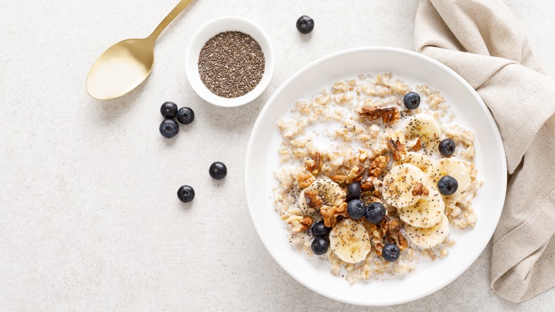 bowl of oatmeal with fruit nuts and chia seeds