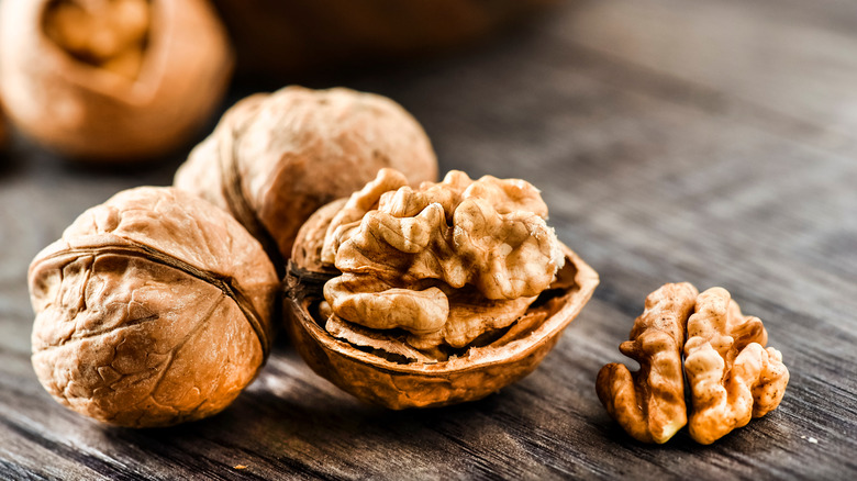 close up of walnuts and walnut shells