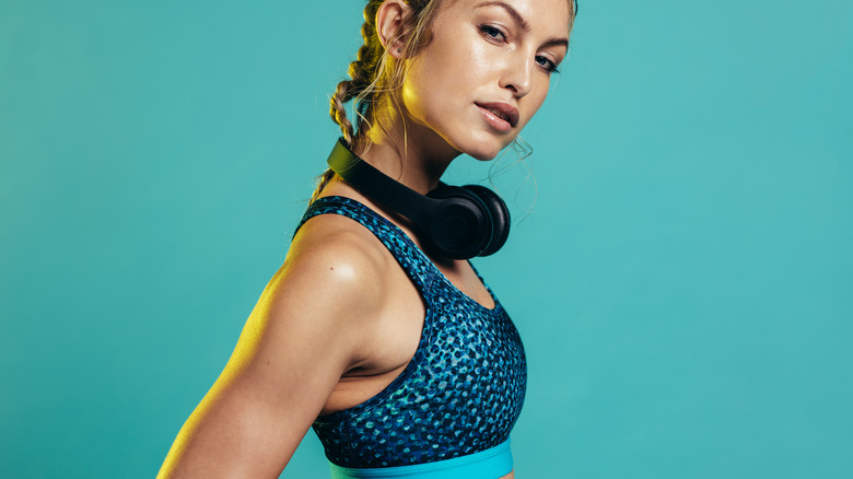 woman wearing sports bra and headphones