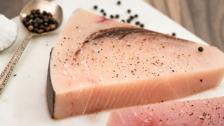 Raw swordfish filet with seasoning