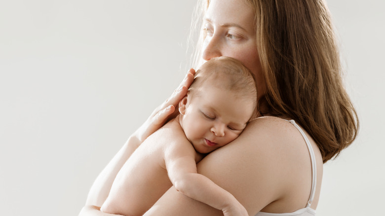 mom holding newborn baby