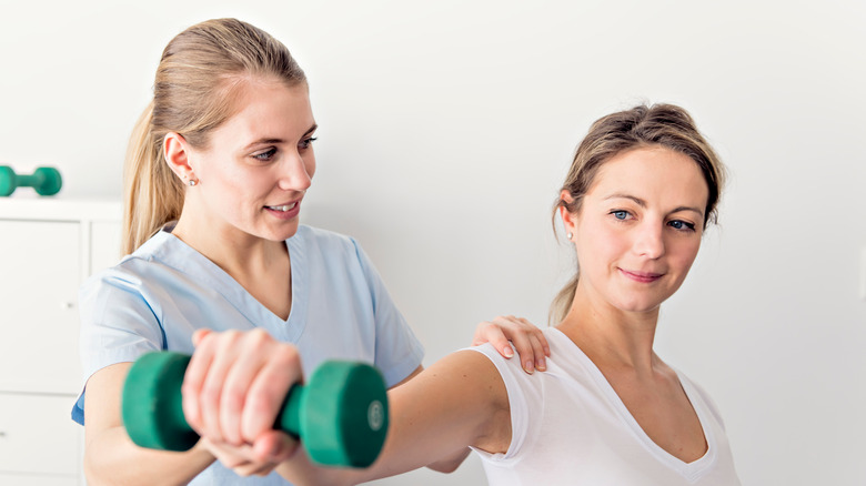 PT and patient doing shoulder exercise