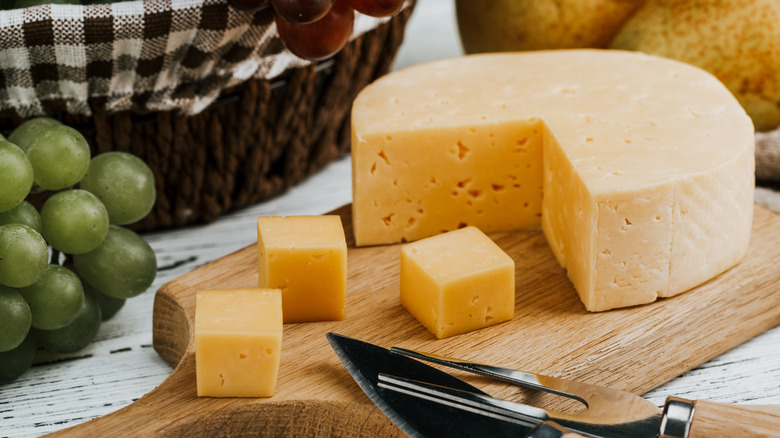 wheel of cheese on board