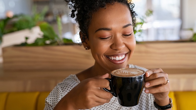 woman enjoying a cup of coffee